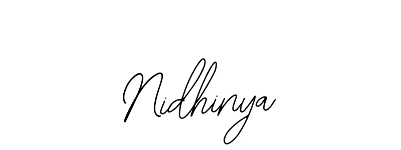 Make a beautiful signature design for name Nidhinya. Use this online signature maker to create a handwritten signature for free. Nidhinya signature style 12 images and pictures png