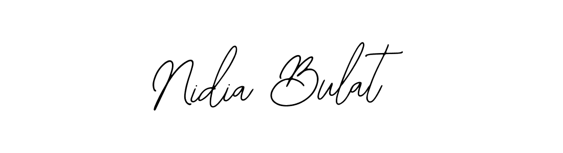 How to make Nidia Bulat name signature. Use Bearetta-2O07w style for creating short signs online. This is the latest handwritten sign. Nidia Bulat signature style 12 images and pictures png