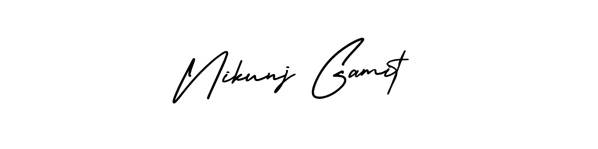 Nikunj Gamit stylish signature style. Best Handwritten Sign (AmerikaSignatureDemo-Regular) for my name. Handwritten Signature Collection Ideas for my name Nikunj Gamit. Nikunj Gamit signature style 3 images and pictures png