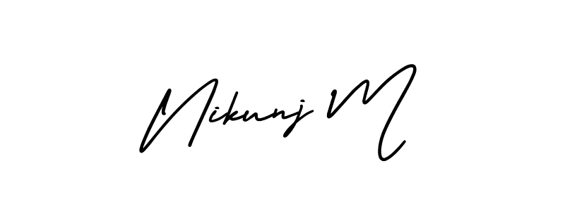 You should practise on your own different ways (AmerikaSignatureDemo-Regular) to write your name (Nikunj M) in signature. don't let someone else do it for you. Nikunj M signature style 3 images and pictures png