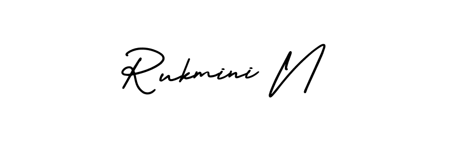 You should practise on your own different ways (AmerikaSignatureDemo-Regular) to write your name (Rukmini N) in signature. don't let someone else do it for you. Rukmini N signature style 3 images and pictures png