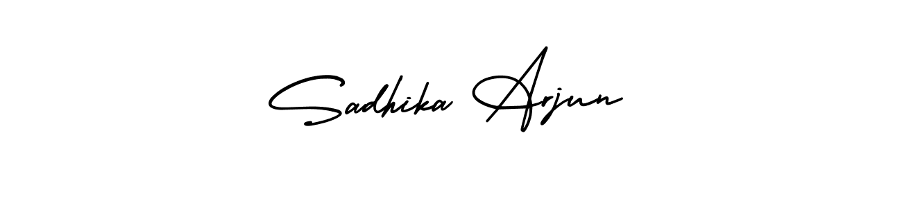 You should practise on your own different ways (AmerikaSignatureDemo-Regular) to write your name (Sadhika Arjun) in signature. don't let someone else do it for you. Sadhika Arjun signature style 3 images and pictures png