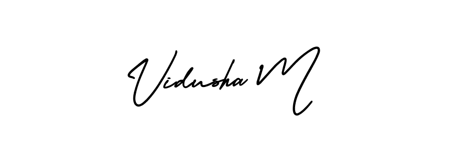You should practise on your own different ways (AmerikaSignatureDemo-Regular) to write your name (Vidusha M) in signature. don't let someone else do it for you. Vidusha M signature style 3 images and pictures png