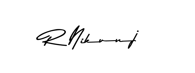 How to make R Nikunj name signature. Use Asem Kandis PERSONAL USE style for creating short signs online. This is the latest handwritten sign. R Nikunj signature style 9 images and pictures png